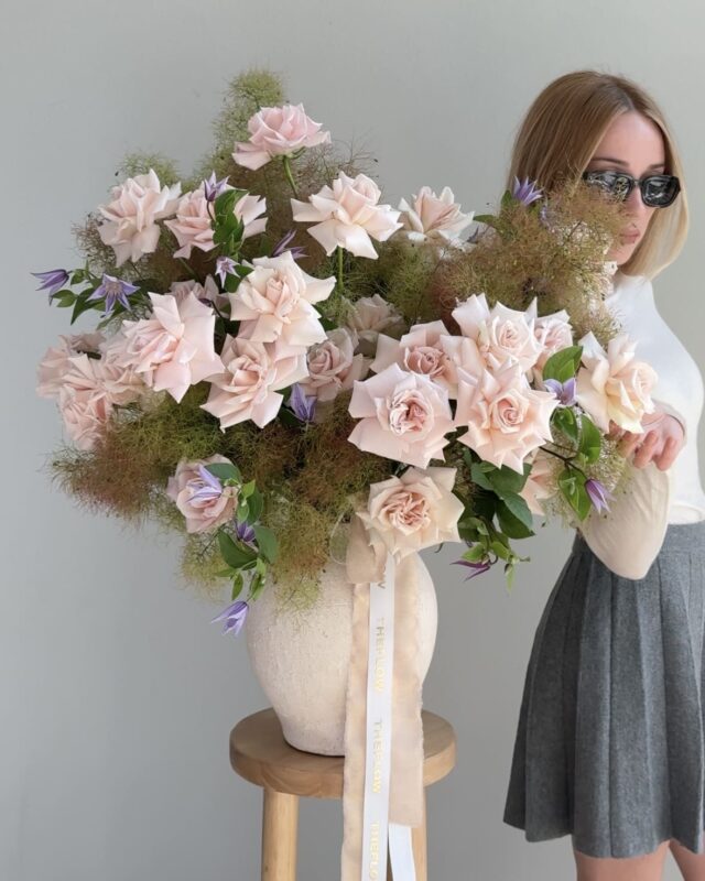 Anita, the founder of TheFlow, with a bouquet