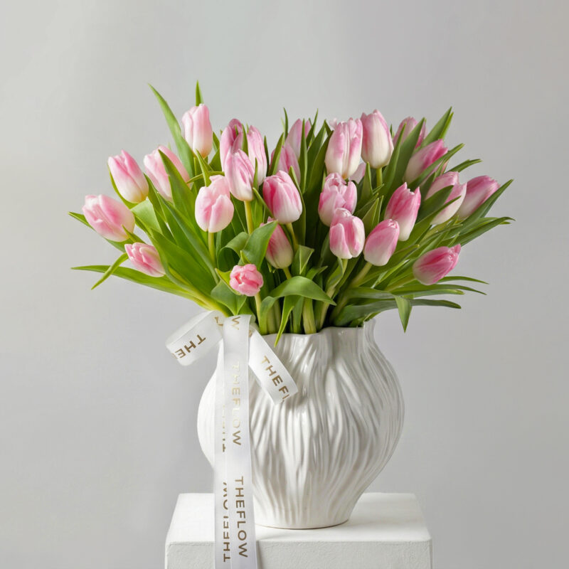 Silk and Vase arrangement of pink tulips in a vase with a ribbon